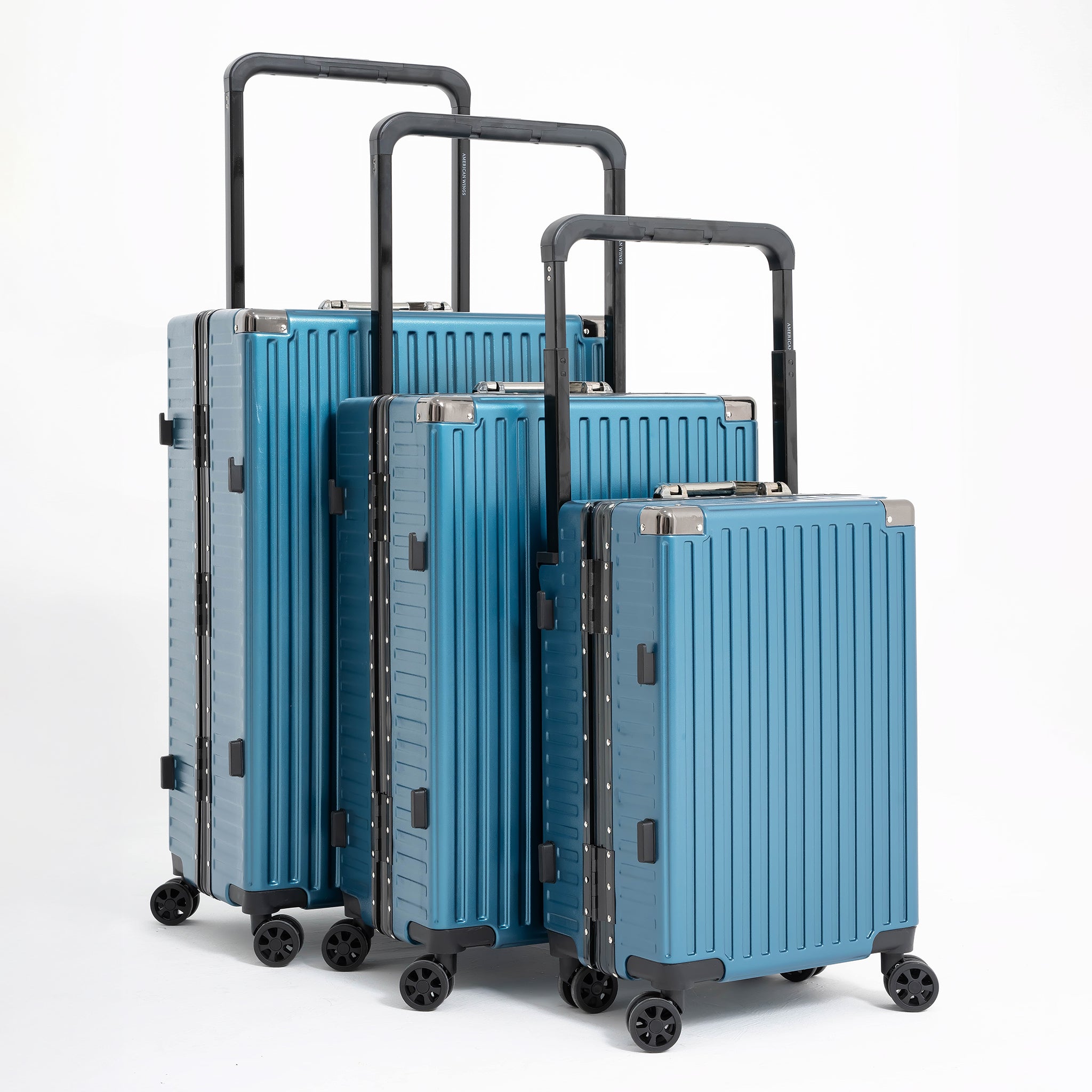 Set of blue suitcases of different sizes on a white background