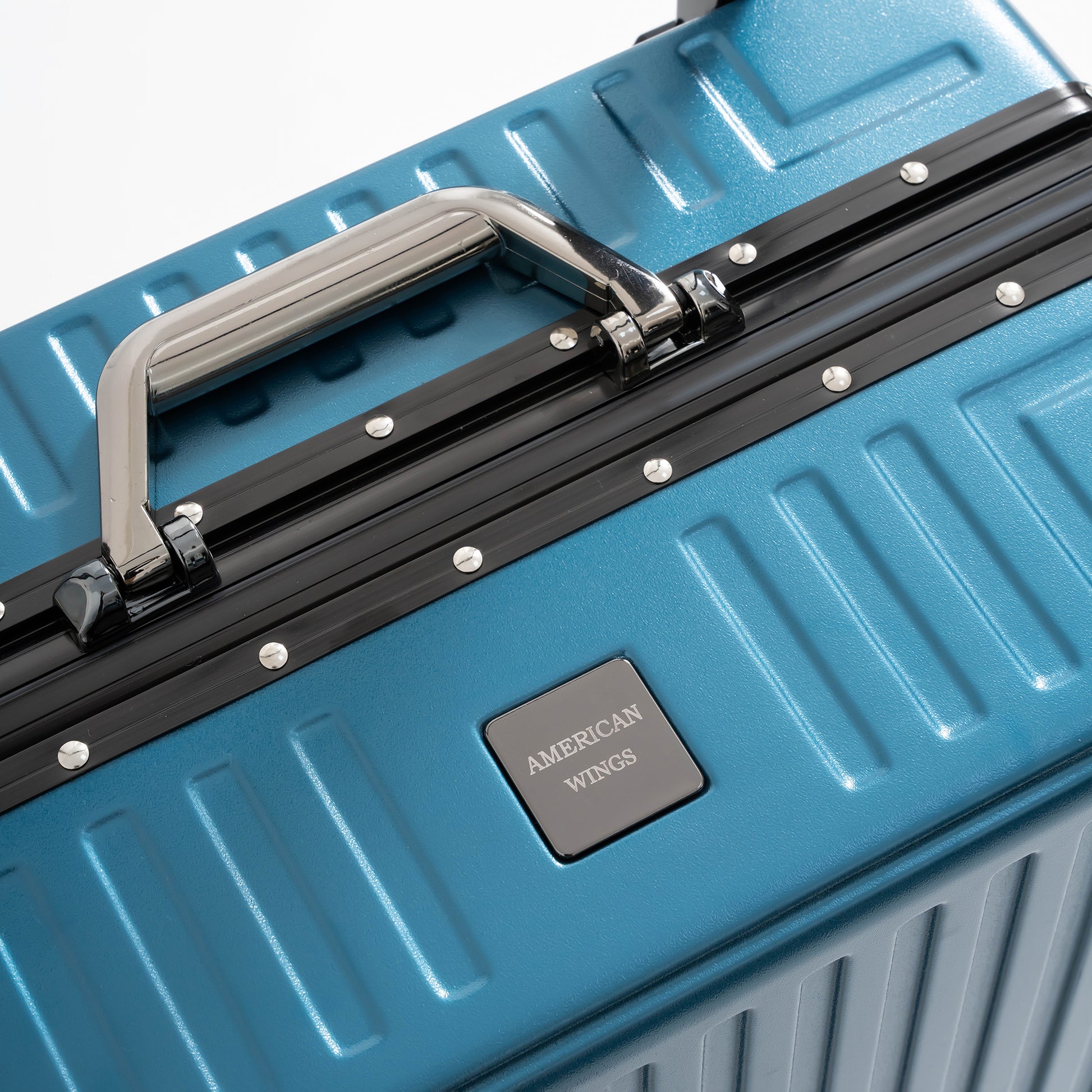 Blue suitcase with American Wings logo on a white background