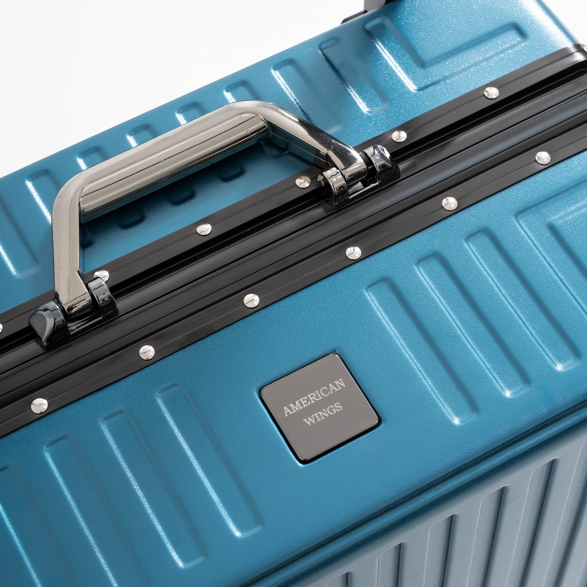 Blue suitcase with American Wings logo on a white background