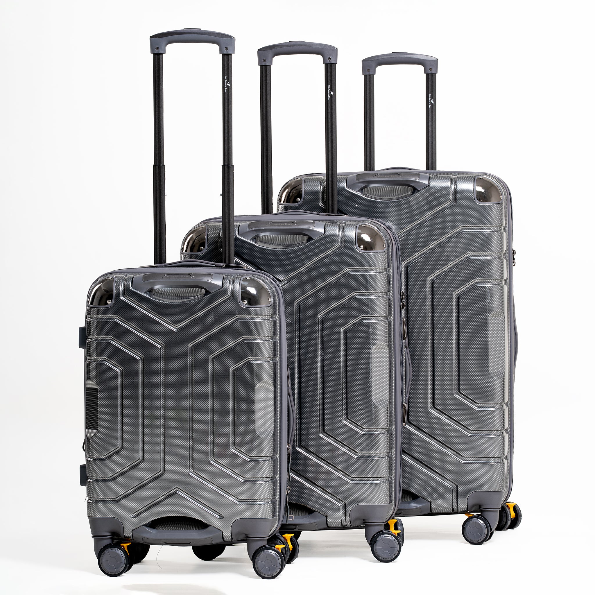 Set of three gray suitcases with geometric design on a white background