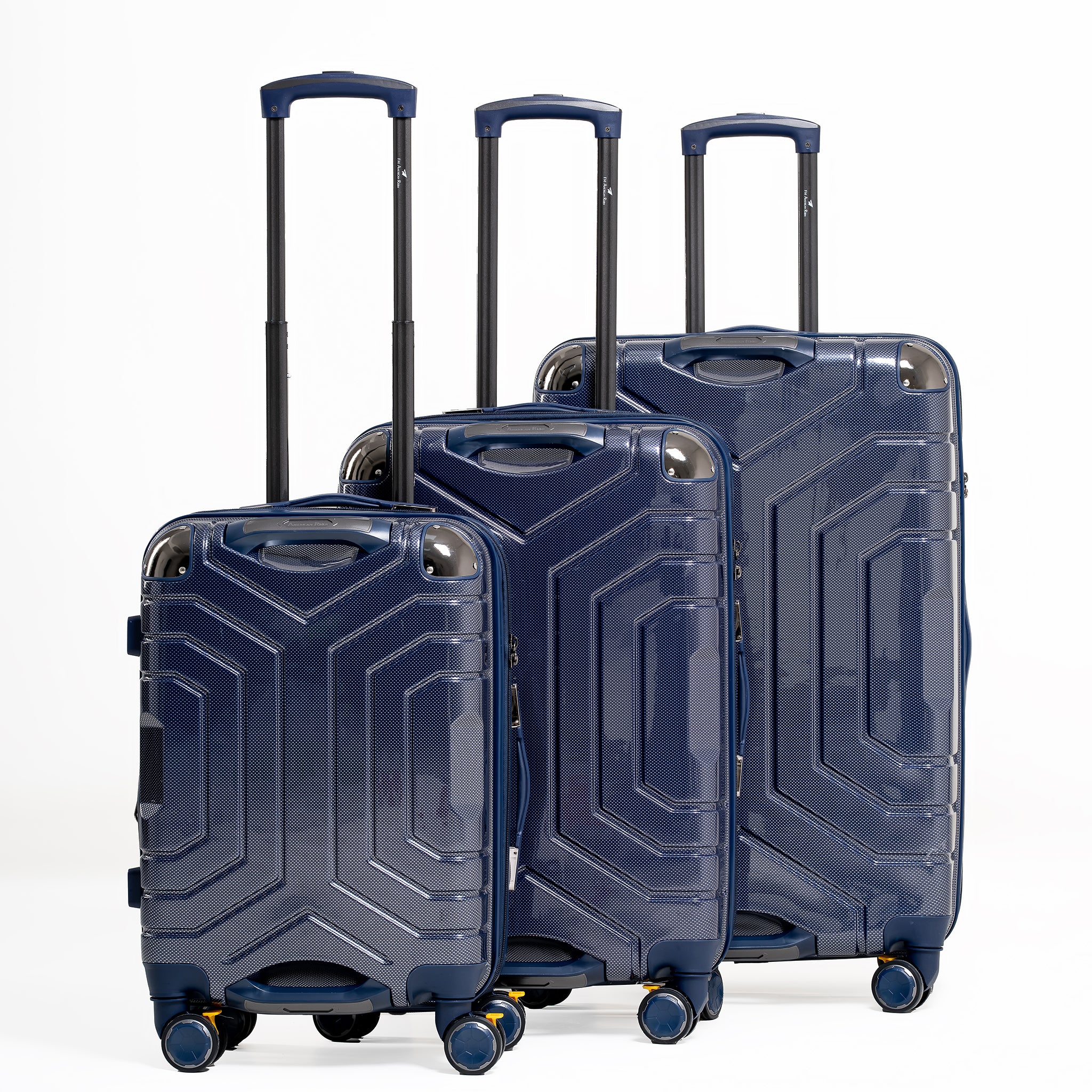 Set of three blue suitcases with geometric design on a white background