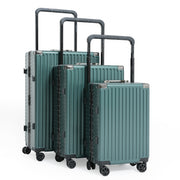 Set of green suitcases with black handles and wheels on a white background