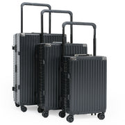 Set of three black suitcases of different sizes on a white background