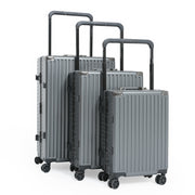 Set of three gray suitcases with black handles on a white background