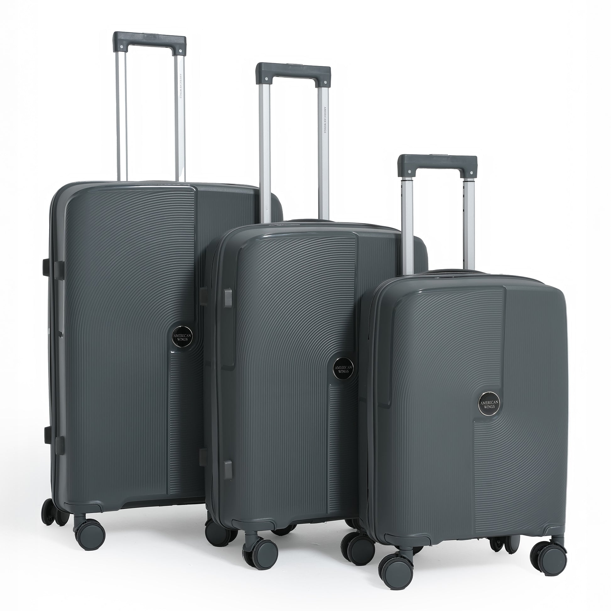 Three gray suitcases of different sizes on a white background