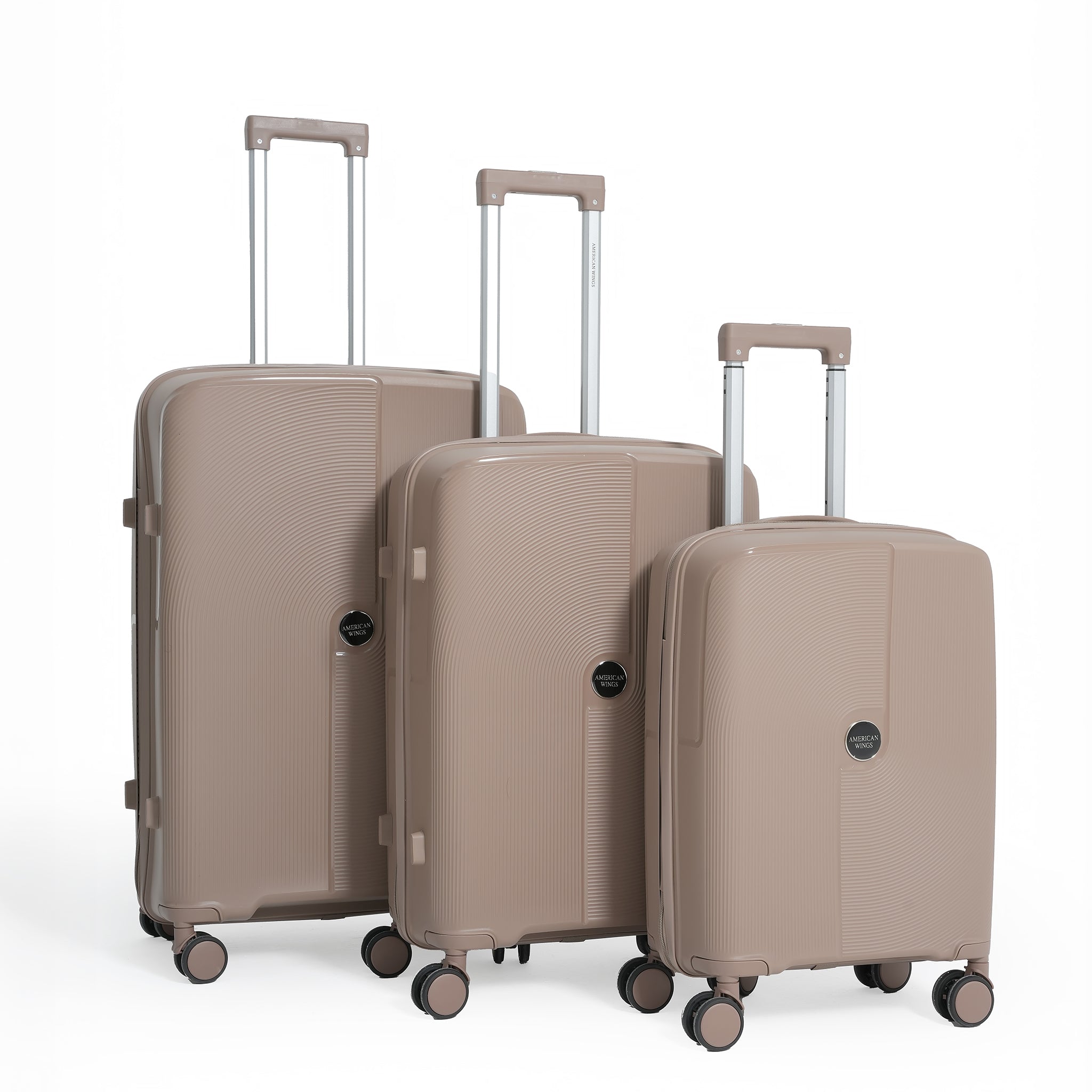 Set of three beige suitcases with wheels on a white background