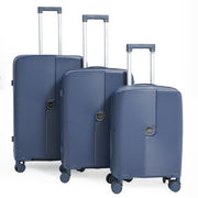 Three blue suitcases of different sizes on a white background