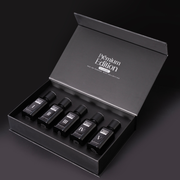 Set of five black bottles labeled I to V in a 'Premium Edition' box on a dark background