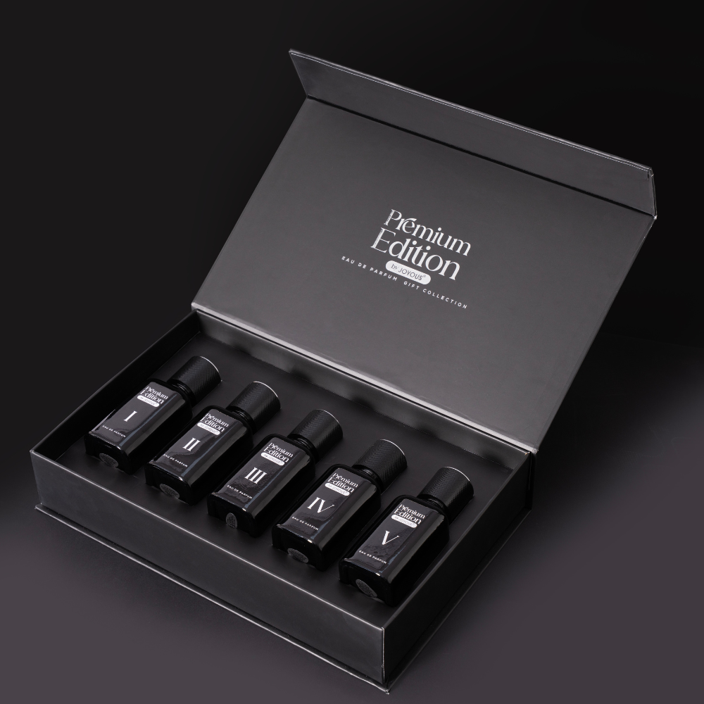 Set of five black bottles labeled I to V in a 'Premium Edition' box on a dark background