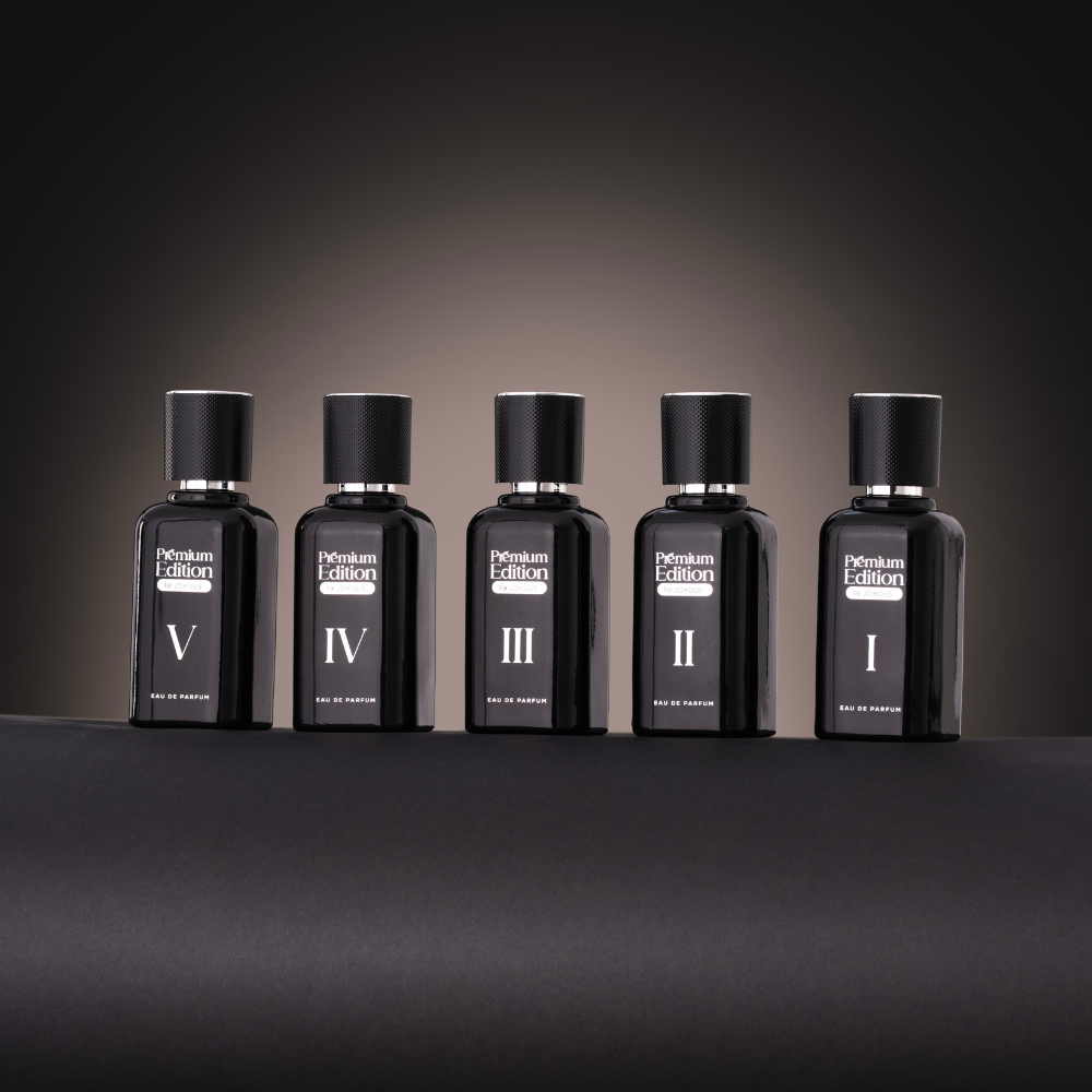 Five black perfume bottles labeled 'I' to 'V' on a dark background