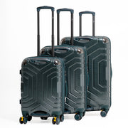 Set of three green suitcases with geometric patterns on a white background
