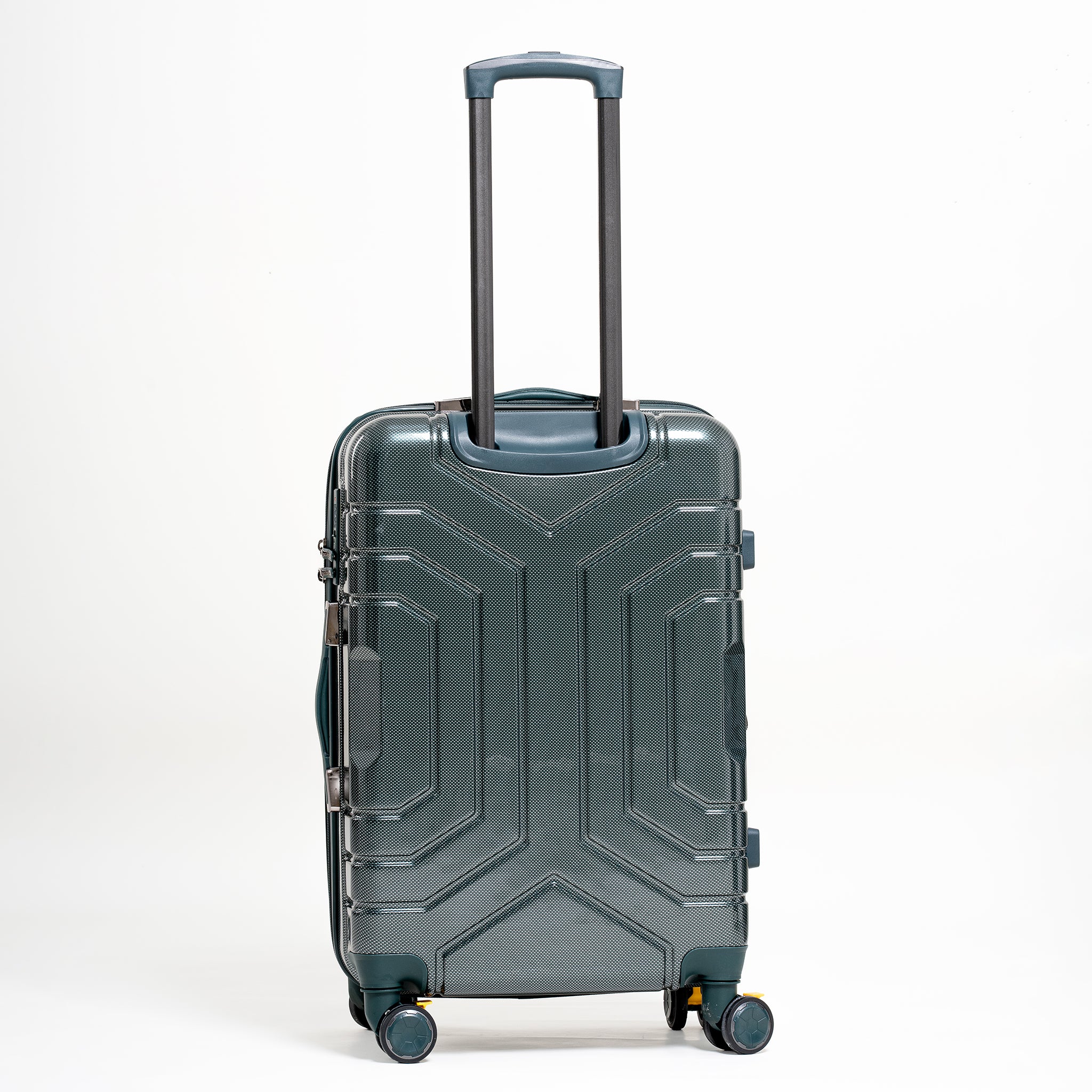 Green suitcase with geometric design on a white background