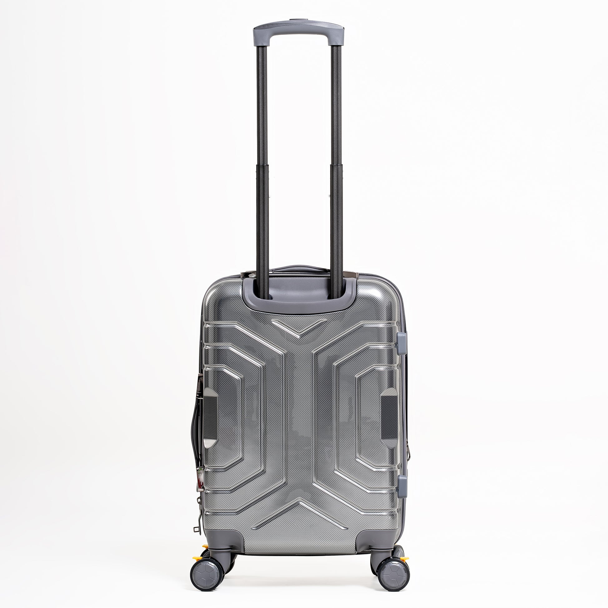 Silver suitcase with geometric design on a white background