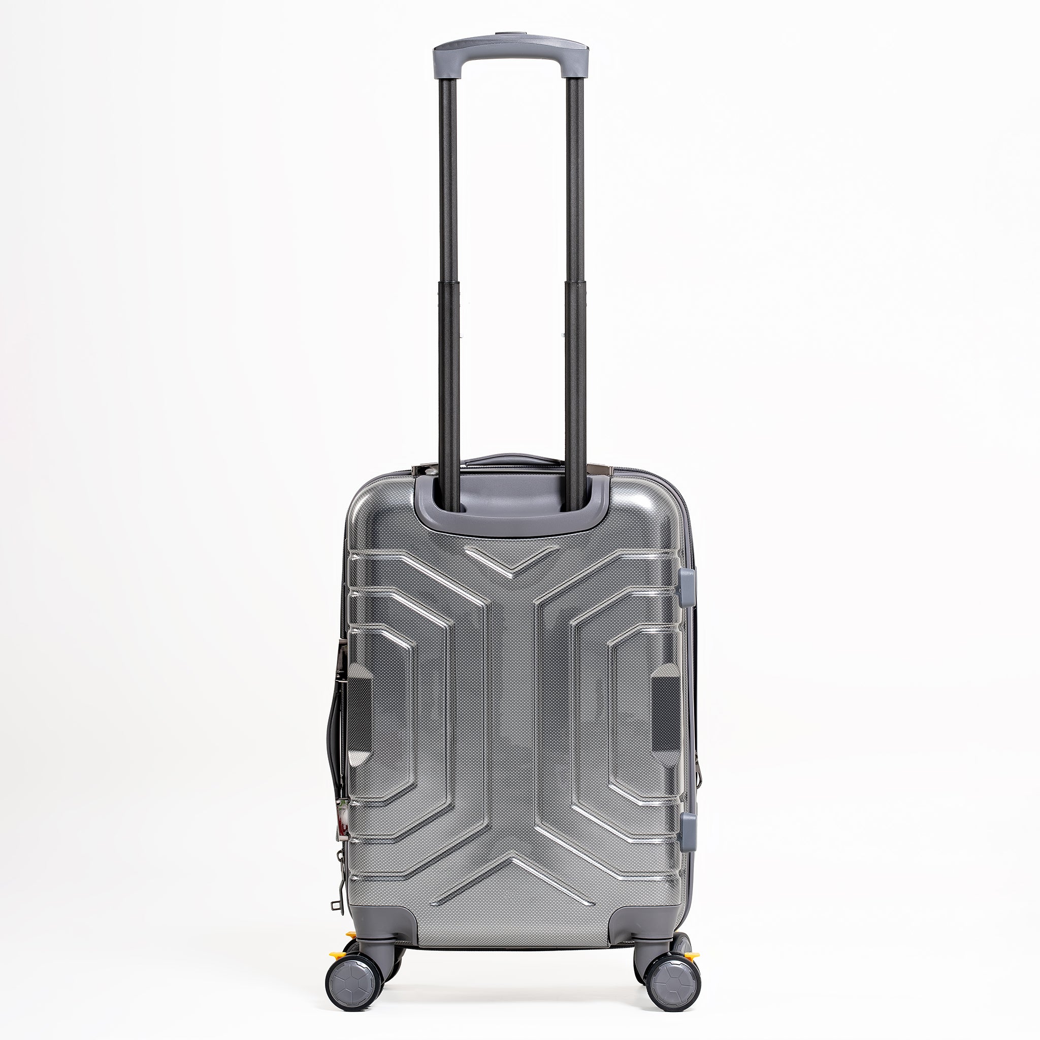 Silver suitcase with geometric design on a white background