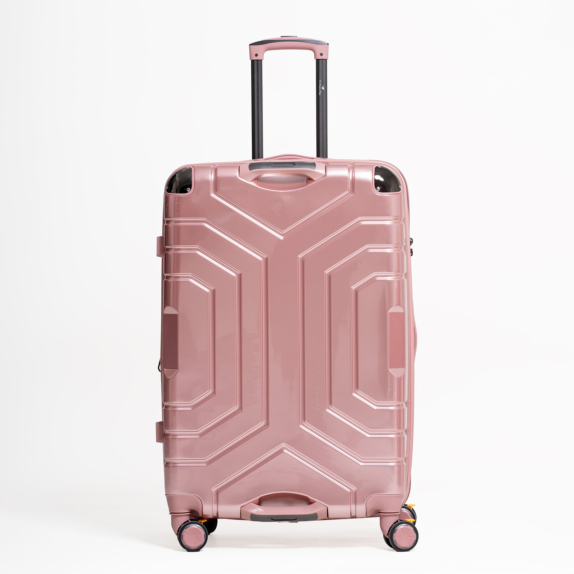 Pink suitcase with geometric design on a white background