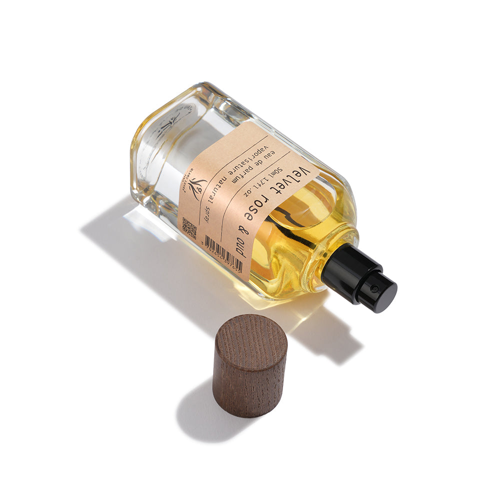 Perfume bottle with cork stopper on a white background
