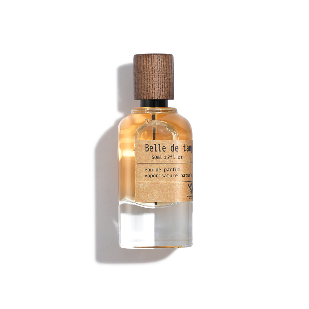 Perfume bottle labeled 'Belle de Tan' on a white background