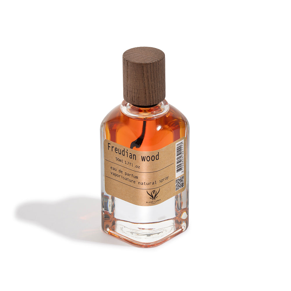 Perfume bottle labeled 'Freudian Wood' on a white background