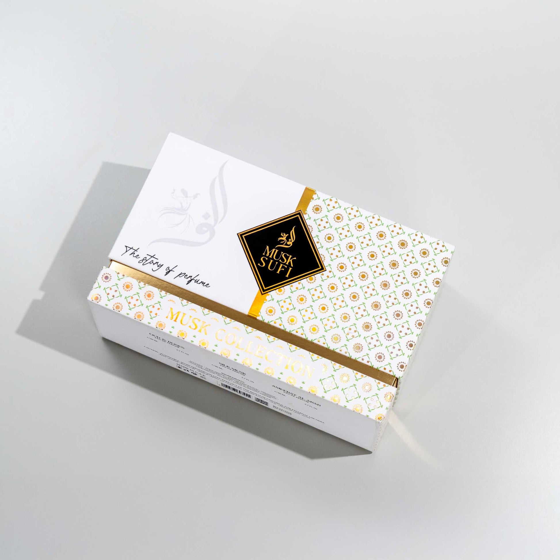 Musk Sufi perfume box with floral design on a light gray background