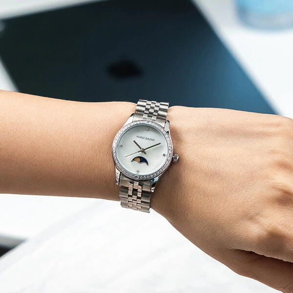 Discover the elegance of the MARKO BALENO LUNAA MB214-A, a luxury wrist watch with a polished silver case, white dial, and silver strap.