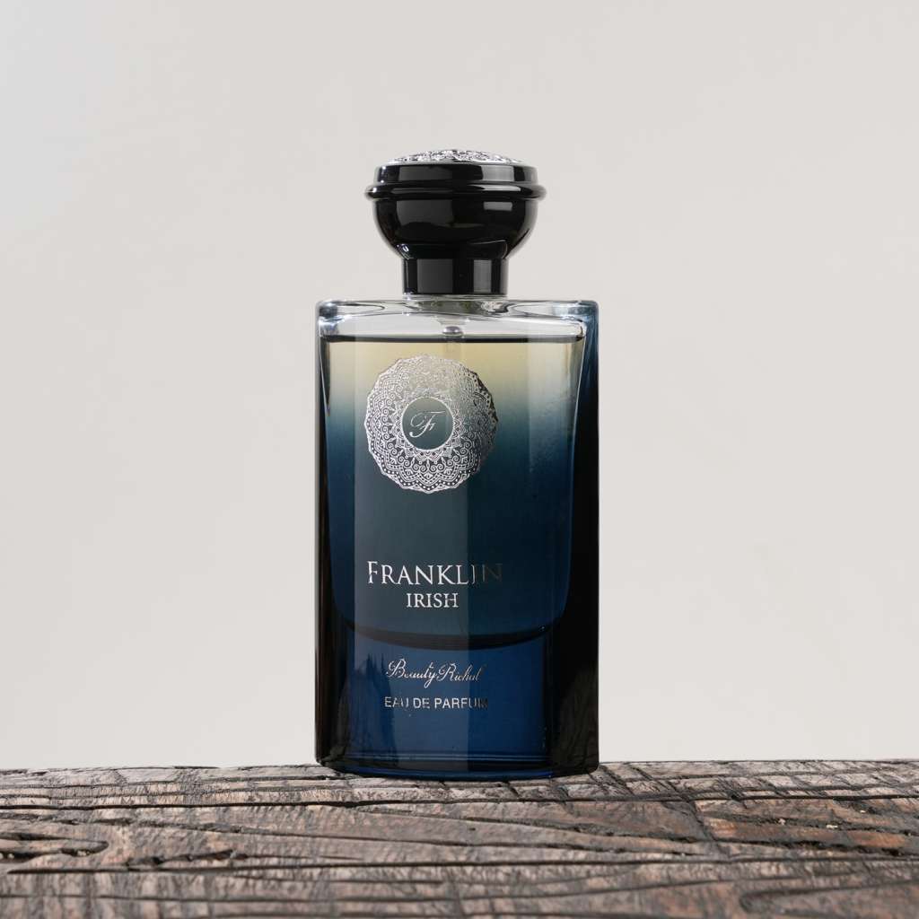 Bottle of Franklin Irish perfume on a wooden surface with a light gray background