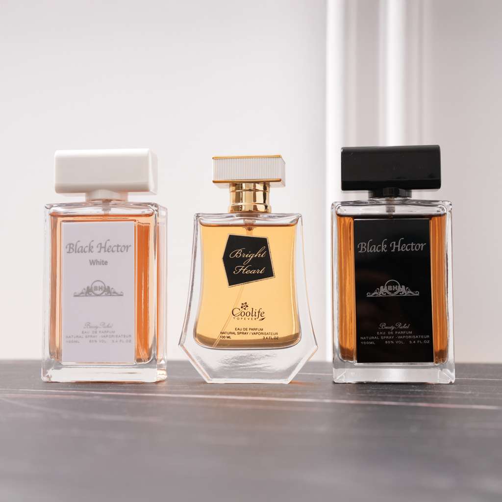 Three perfume bottles from different brands on a reflective surface with a light gray background