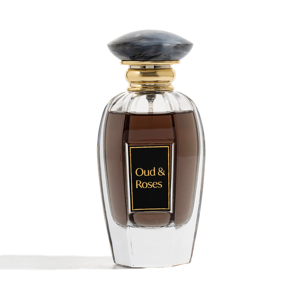 Perfume bottle labeled 'Oud & Roses' on a white background