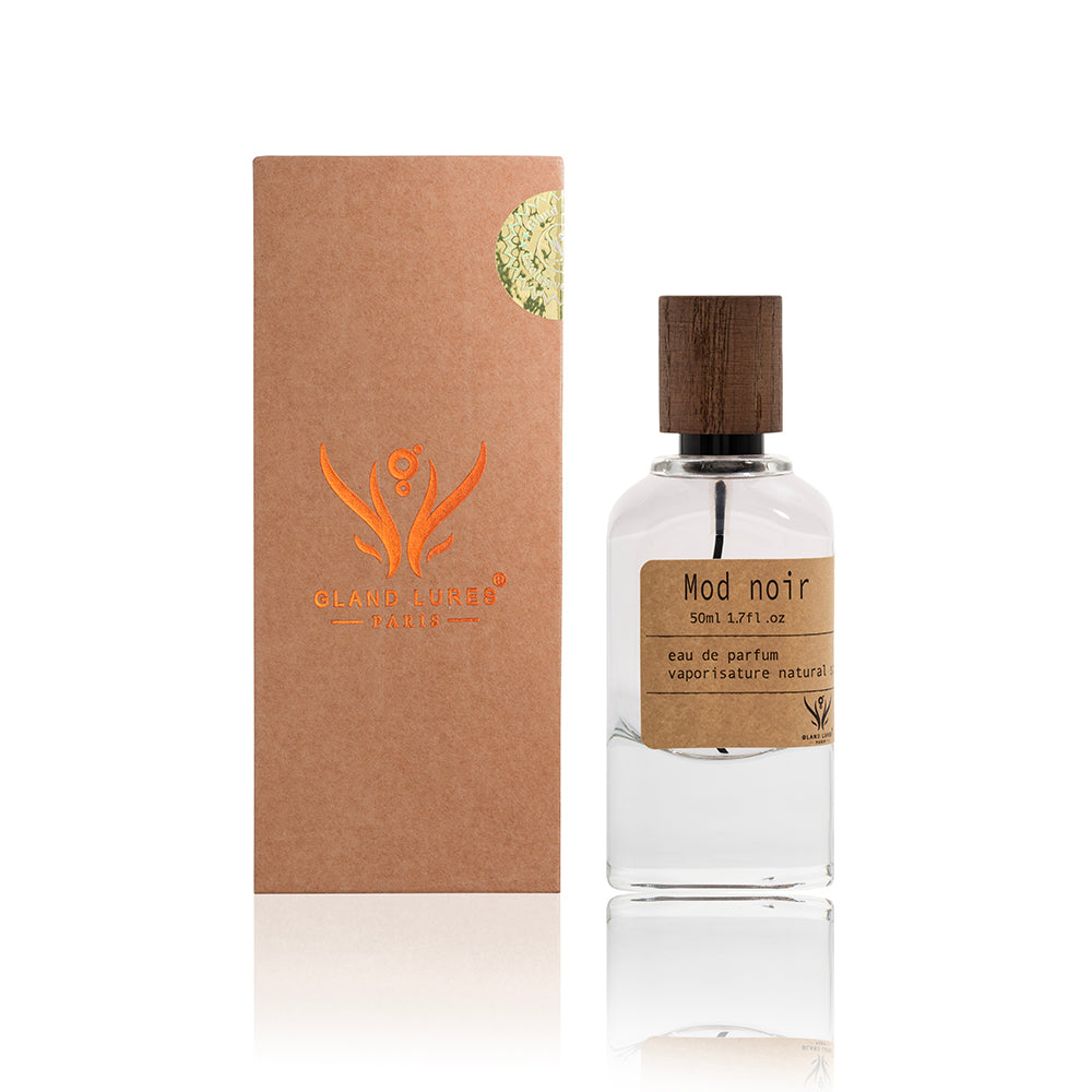 Perfume bottle with wooden cap and brown packaging on a white background