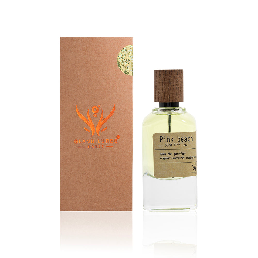 Perfume bottle labeled 'Pink beach' with a matching brown box on a white background