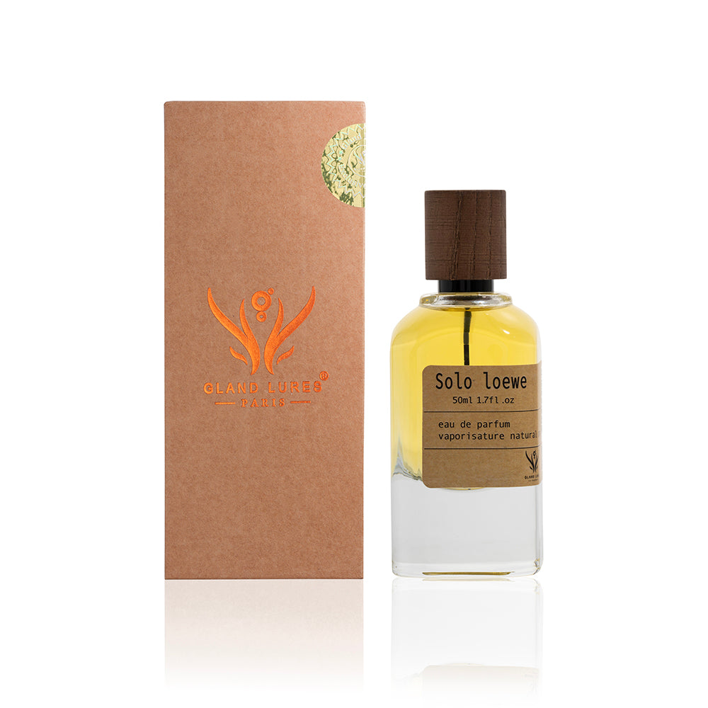 Perfume bottle with wooden cap and brown packaging box featuring a logo on a white background