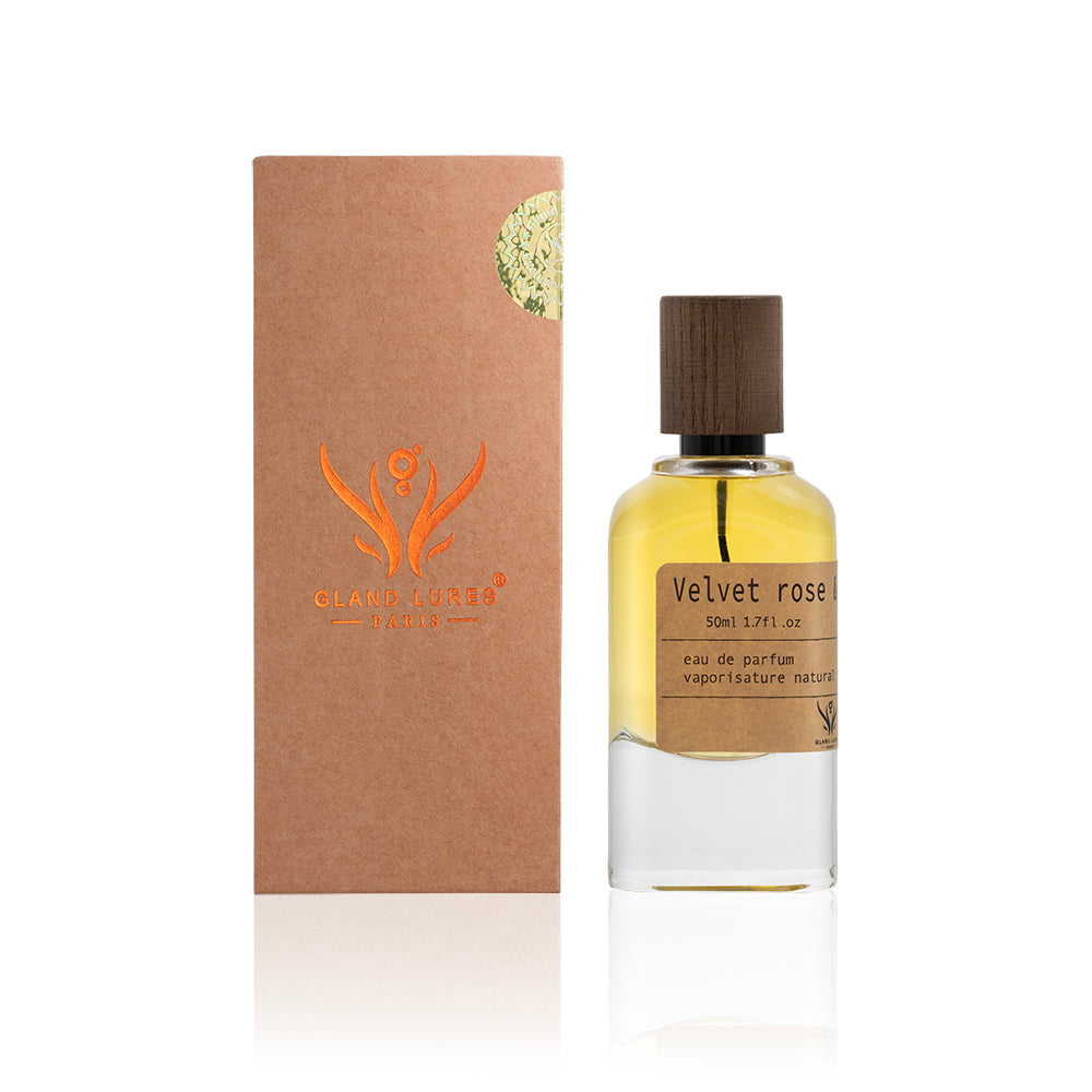 Perfume bottle labeled 'Velvet Rose' with a matching brown box on a white background